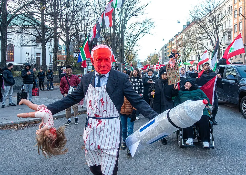 Demonstration in support of Palestine in Sweden with butcher imagery