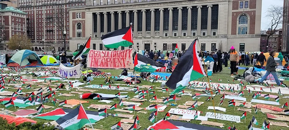 Gaza solidarity encampment with Palestinian flags